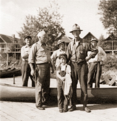 Harris S. Colt, grandson of longtime Parmachenee Club member Harris D. Colt of New York City, poses with the staff of the private hunting-fishing club at Parmachenee Lake.